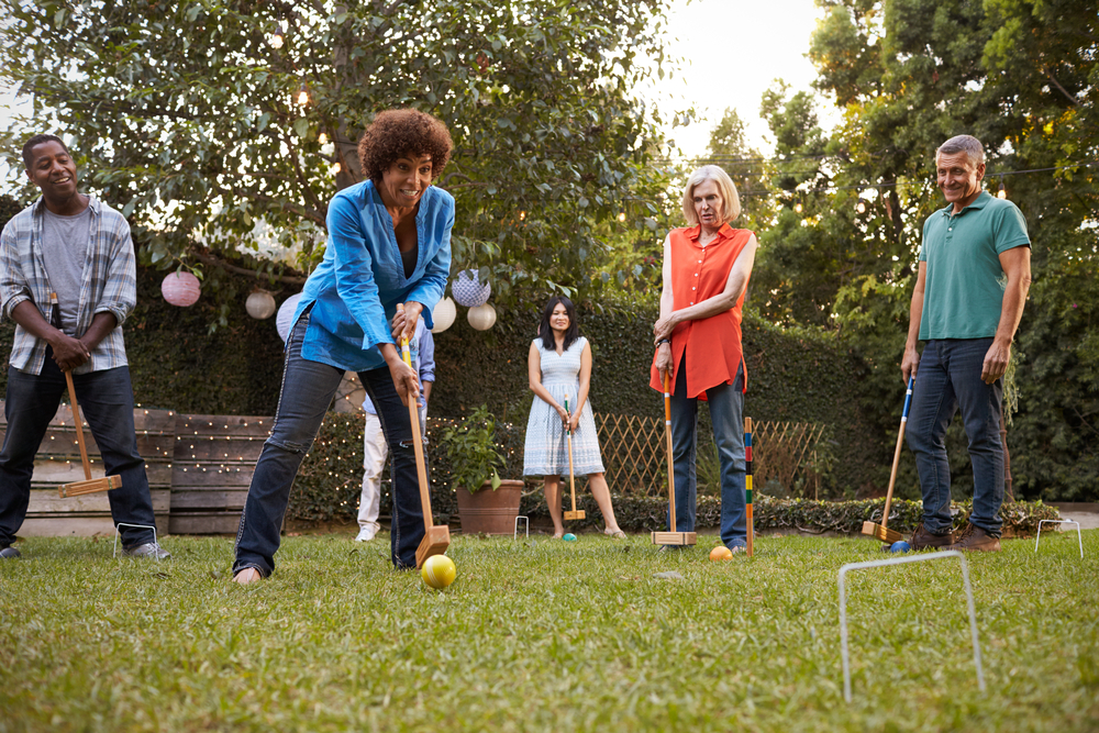 Family playing backyard games together