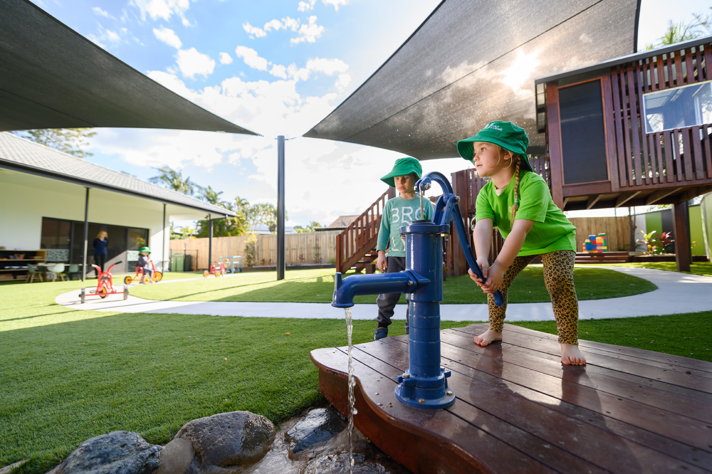 Children pumping water at Edge Early Learning