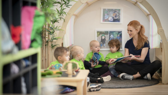 Educator reading to group of children