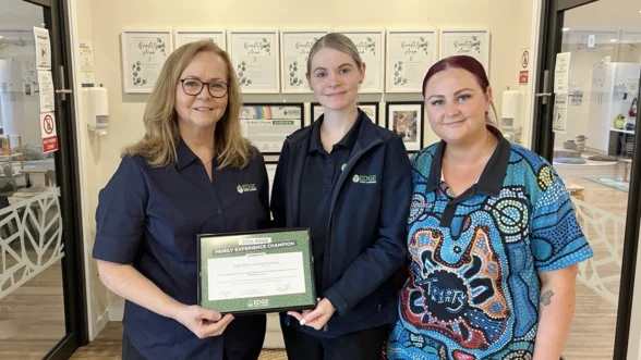 Area Manager Kathryn presenting the Family Experience Champion Award to Edge Wynnum Centre Director.